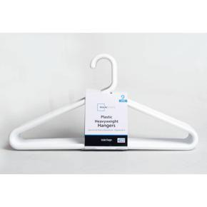 WHITE HANGERS IN A PACK OF HALF DOZEN HANGERS FOR CLOTHING